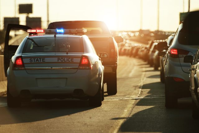Police officer pulling over a truck